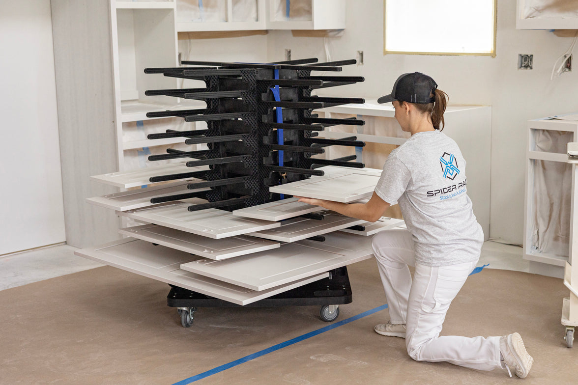 Female using Spider Racks portable paint drying rack